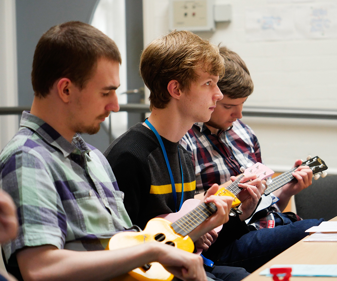 Greenbank College students learning to play the Ukelele at one of their enrichment sessions